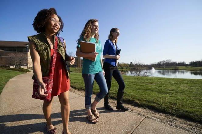 Ursuline students walking to class on a sunny day.